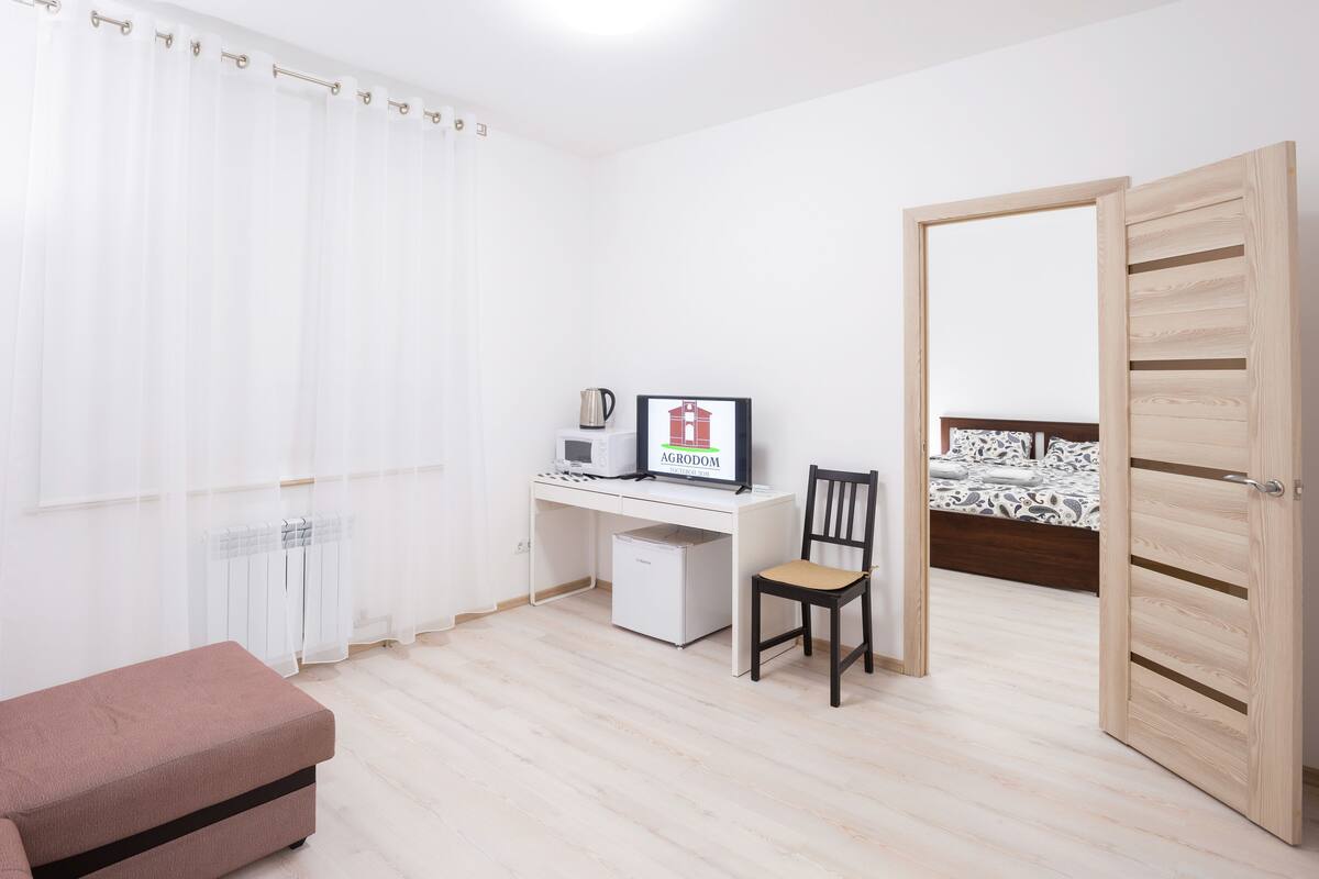 Family Quadruple Room, Multiple Beds, Garden View | Living room