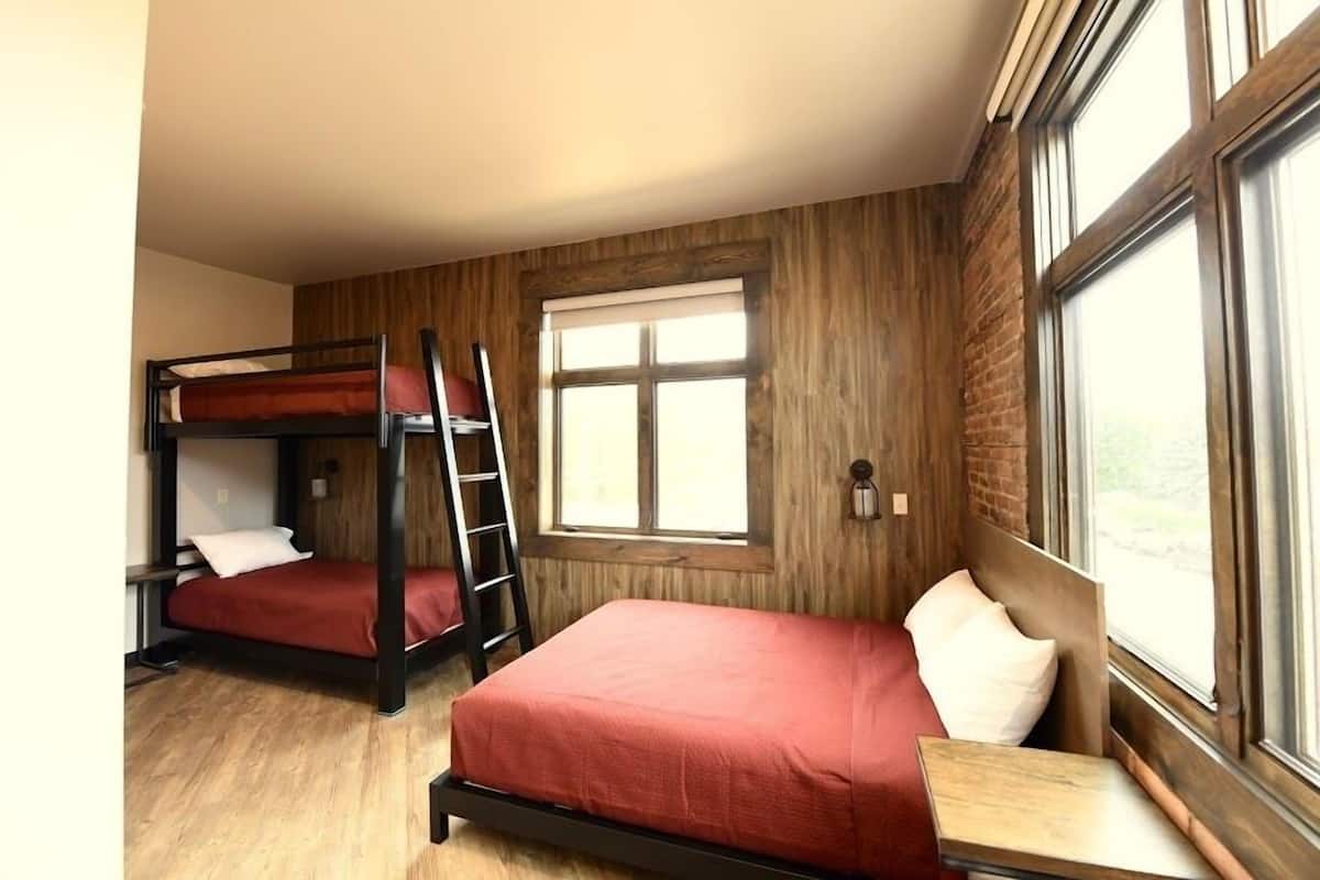 Room 1 @ 30 W Main Street | Premium bedding, individually decorated, individually furnished