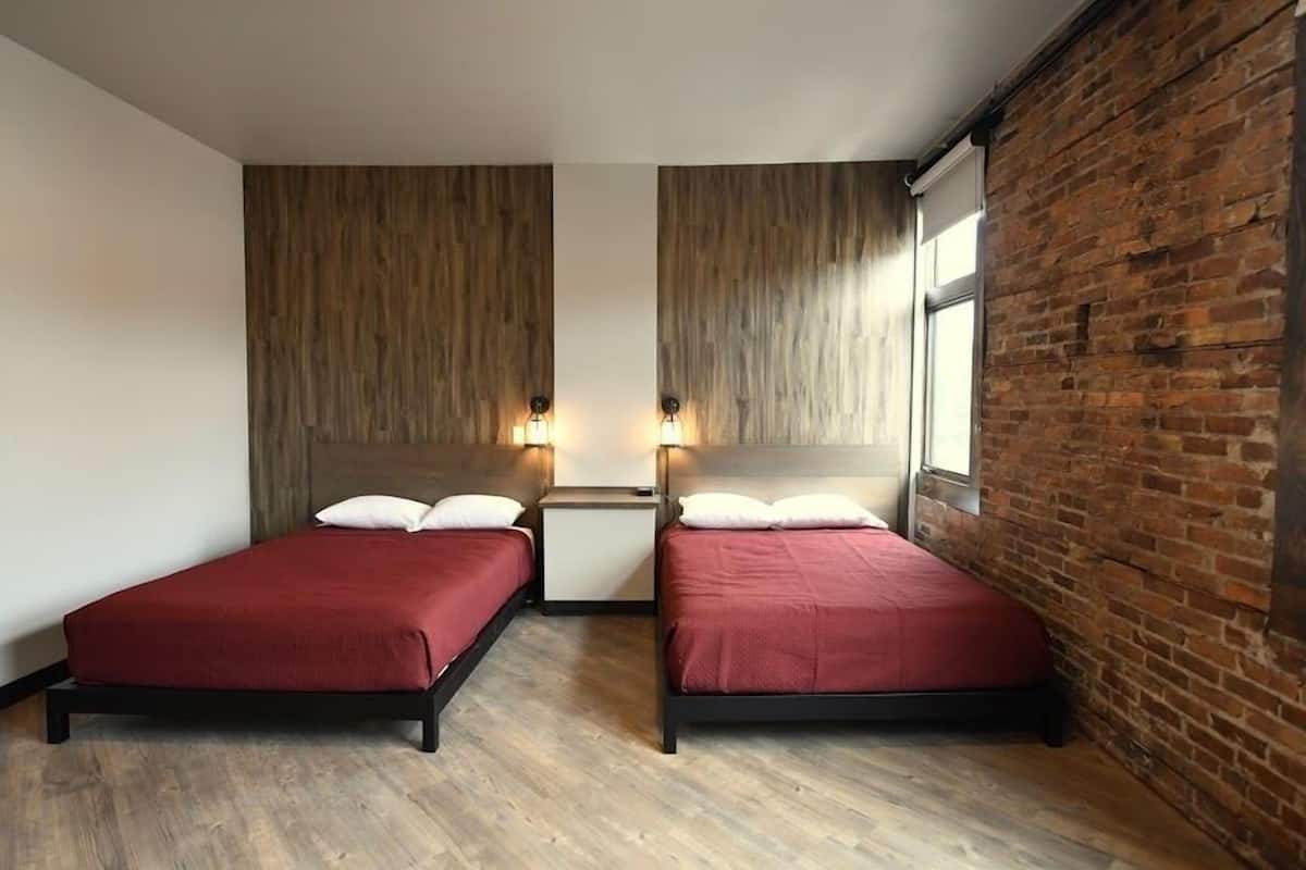Room 2 @ 30 W Main Street | Premium bedding, individually decorated, individually furnished