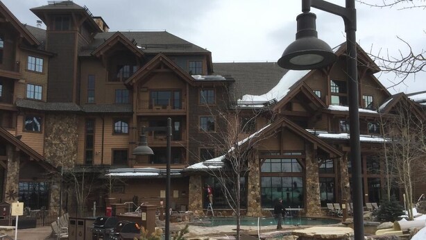 A lodge with multiple buildings, outdoor seating, a pool, and a snow-covered landscape. - Upscale slope side resort in Breckenridge, CO (Breckenridge)