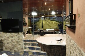 Separate bathtub and shower, jetted bath, rainfall showerhead, towels