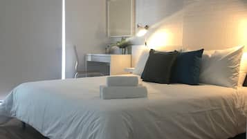 1 bedroom, desk, iron/ironing board, travel crib