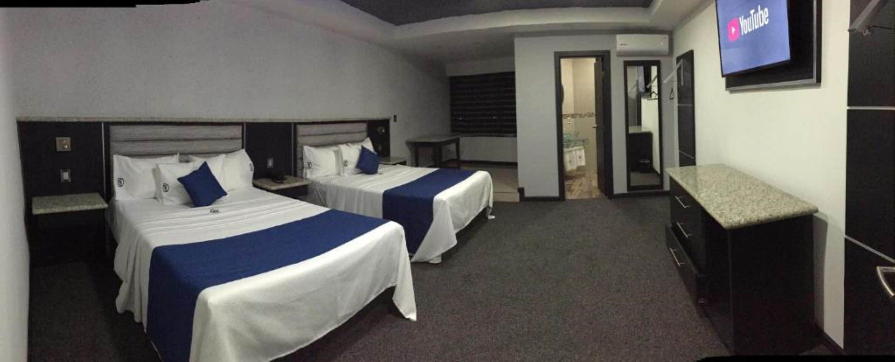 deluxe double room, 2 queen beds | premium bedding, memory-foam beds, laptop workspace, iron/ironing board