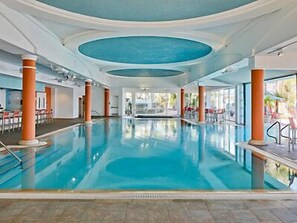 Indoor pool, a heated pool - Close to SeaWorld Spacious Two Bedroom w/ pools, hot tubs, bbq pits and family adventures (Orlando)