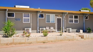 A motel with a sign reading "GETAWAY VILLAS" and air conditioning units on the exterior. - Getaway Villas Unit 38-9 - comfort on a budget (EXMOUTH)