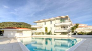 A modern two-story building with a swimming pool in front. - Royal Rivage by Interhome (Carqueiranne)