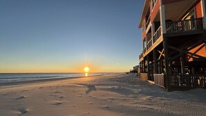 A beach with a building featuring a balcony overlooking the ocean. - Livin the Dream - Beachfront, 6/6, POOL, Pet Friendly, Sleeps 15 (Dauphin Island)