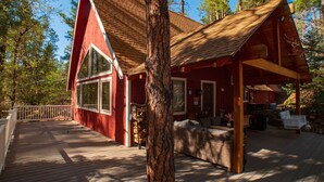 A cabin with a deck, large windows, and a covered outdoor area. - *Peaceful getaway *Close to Goldwater Lake *Cabin (Prescott)