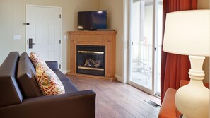 Televisie, een open haard, videospelletjes en een dvd-speler