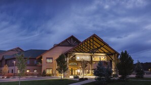 A hotel with a prominent entrance, a sign for 'Wyndham Vacation Ownership', and a 'Glacier Canyon Lodge' sign. - Glacier Canyon Resort With Free access to WaterParks and other Amenities (Baraboo)