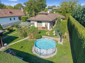 A residential property with a swimming pool, a covered patio, and a well-maintained garden. - Petříkov by Interhome (Petrikov)