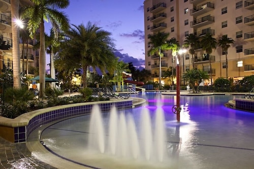 Relax at our Palm Tree secluded Resort with a poolside bar and waterslide