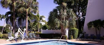 Relax at our Palm Tree secluded Resort with a poolside bar and waterslide