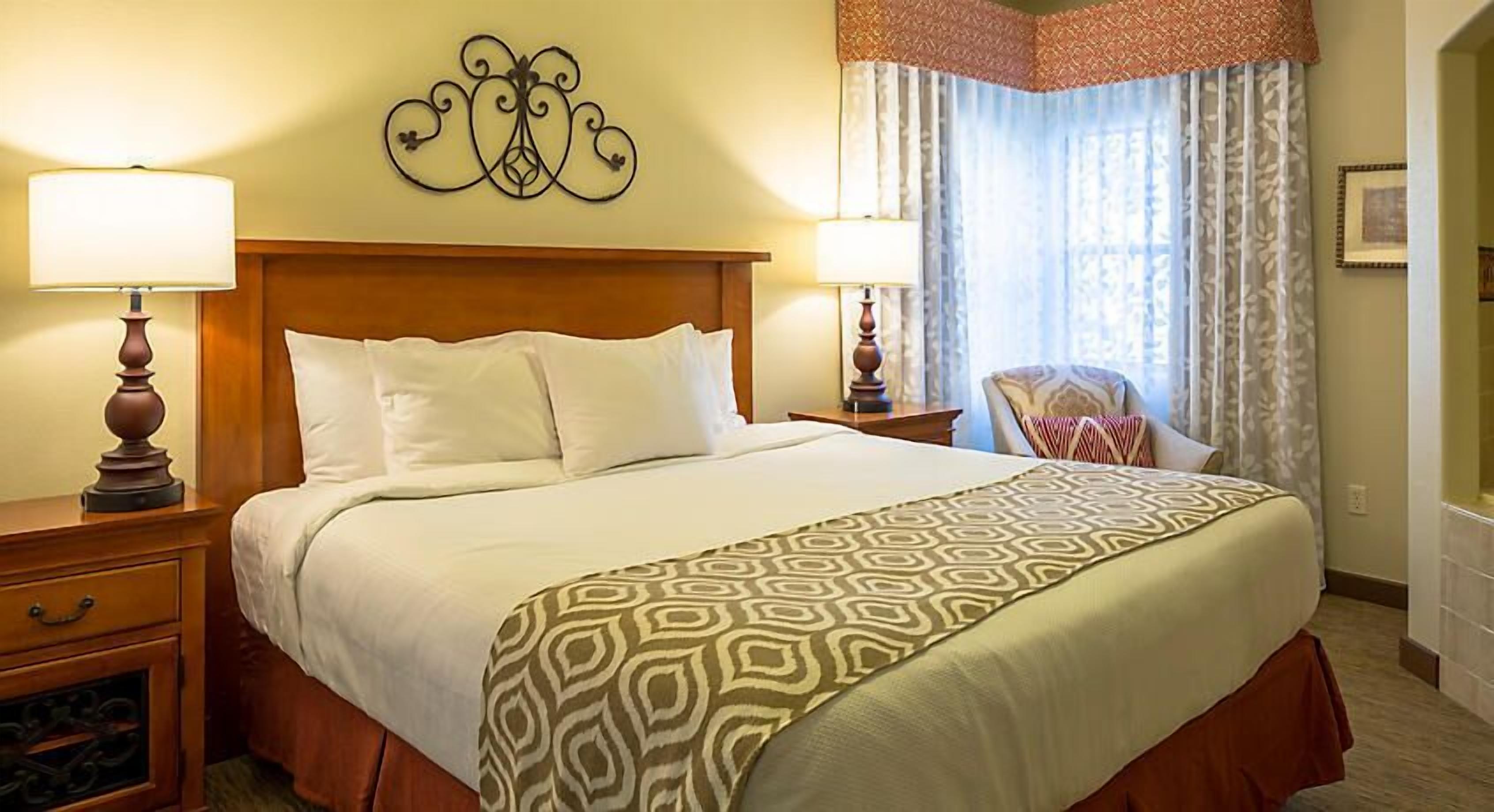 UpScale Resort with Outdoor Heated Pool with a waterslide and a poolside bar, tennis court and gym