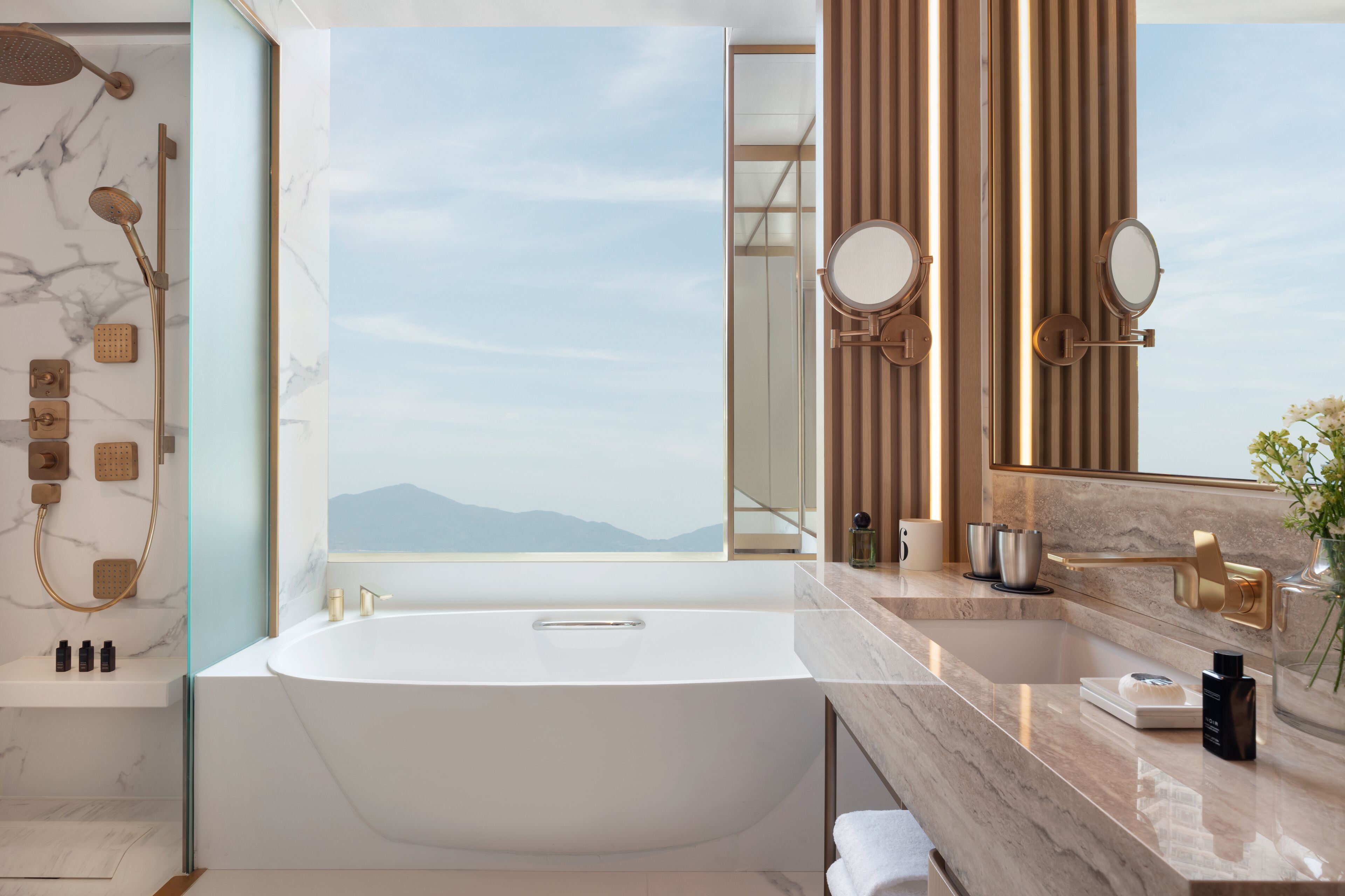 designer toiletries, hair dryer, bathrobes, slippers