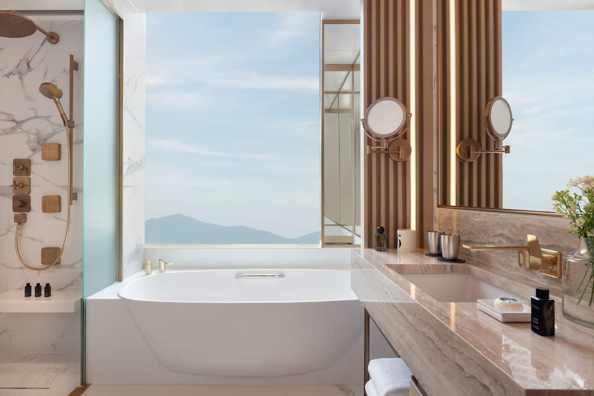 designer toiletries, hair dryer, bathrobes, slippers