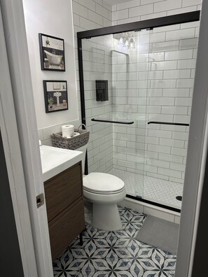Shower, hair dryer, towels, soap