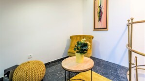 Apartamento, 1 habitación | Zona de estar | Una televisión de pantalla plana