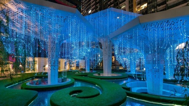 A modern indoor garden with geometric pathways and illuminated structures. - Arte Plus by Poly City (Kuala Lumpur)