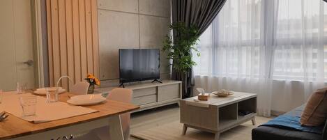 Apartment, 2 Bedrooms | Living room | Flat-screen TV
