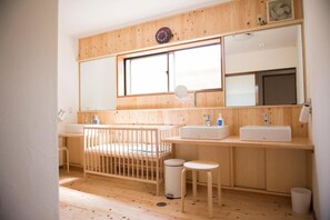 Separate bathtub and shower, free toiletries, hair dryer, slippers
