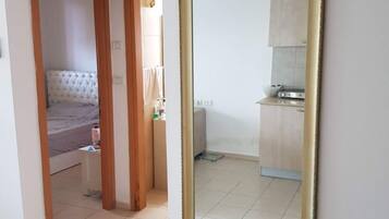 Luxury Apartment, Smoking, Sea View | Living area | 55-inch flat-screen TV with cable channels, TV