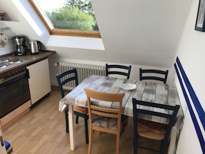 Apartment, Private Bathroom (5 Langeoog) | Private kitchen | Fridge, coffee/tea maker, electric kettle, high chair - Mühlenhof Nesse (Dornum)