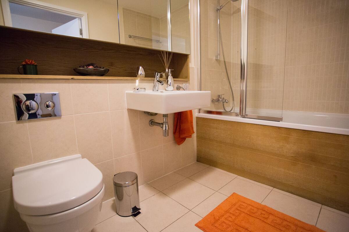 Luxury Apartment, 1 King Bed | Bathroom | Combined shower/tub, deep soaking tub, rainfall showerhead
