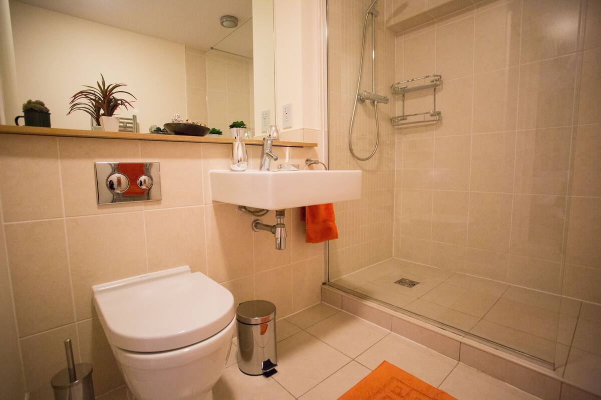 Luxury Apartment, 1 King Bed, City View | Bathroom | Combined shower/tub, deep soaking tub, rainfall showerhead