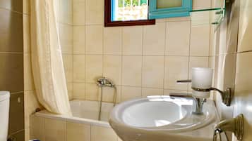 Combined shower/tub, hair dryer, towels, soap