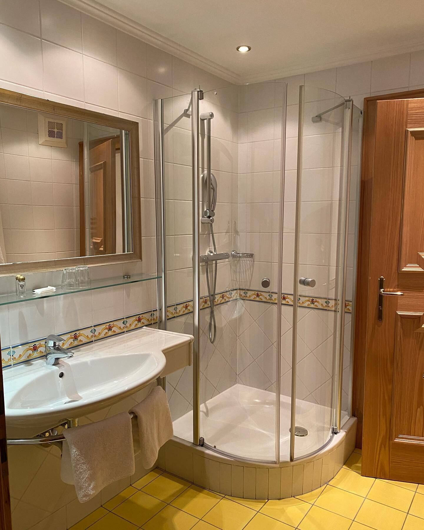 shower, hair dryer, bathrobes, towels