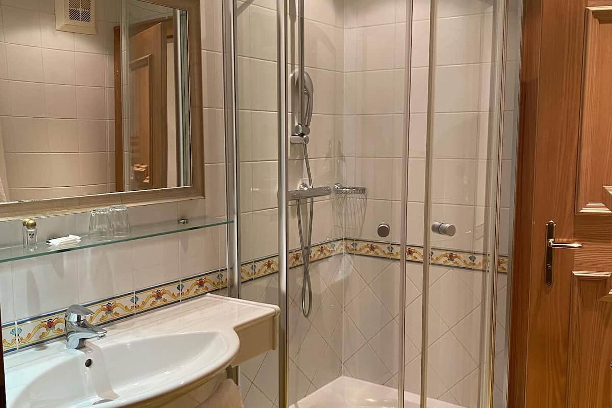 shower, hair dryer, bathrobes, towels