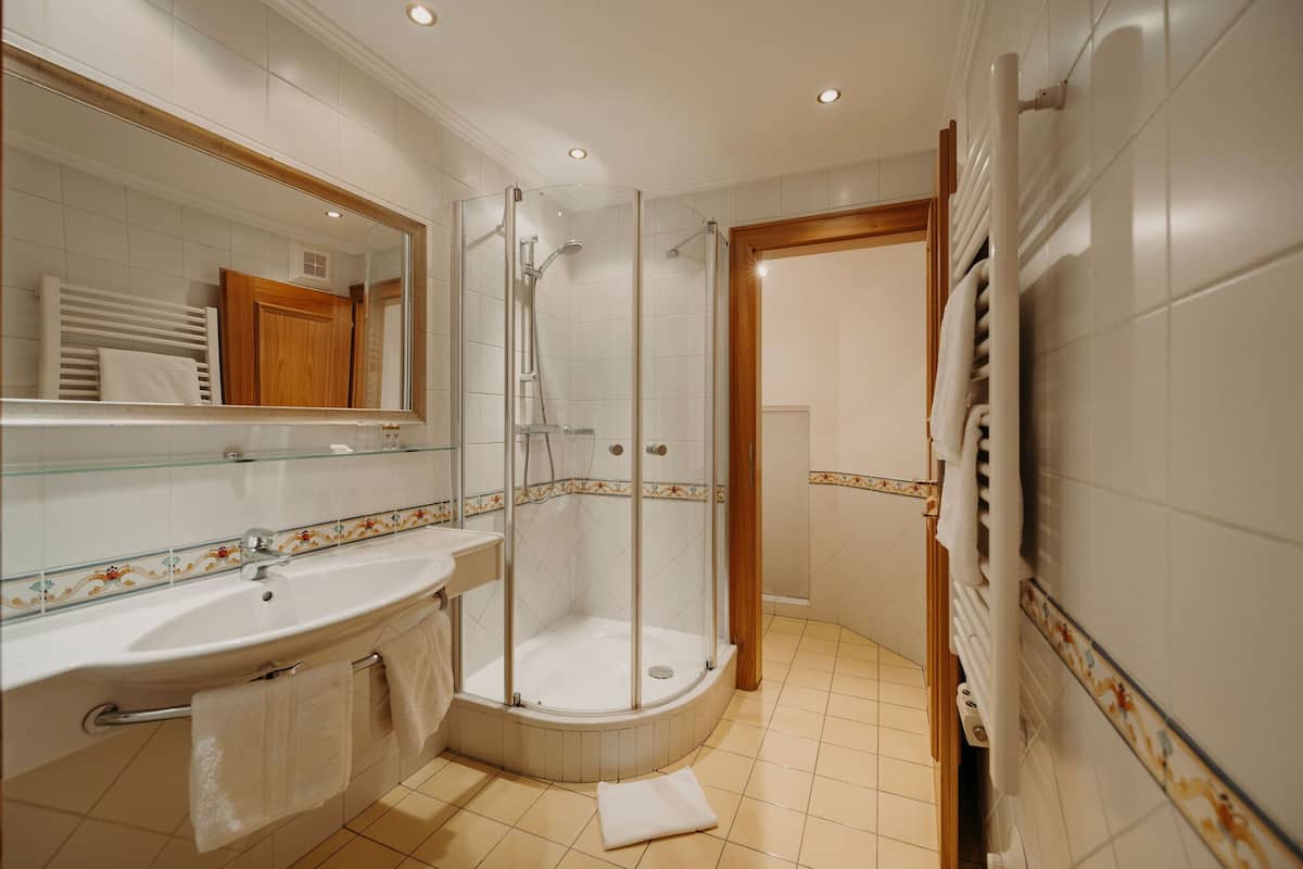 shower, hair dryer, bathrobes, towels