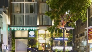 A multi-story building with a sign reading "Zazz Hotel" at the entrance. - Zazz Urban Ho Chi Minh Hotel (Ho Chi Minh City)