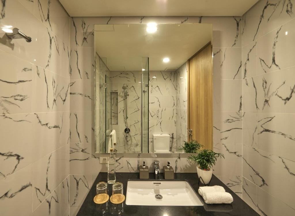 designer toiletries, hair dryer, bathrobes, slippers