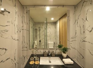 Designer toiletries, hair dryer, bathrobes, slippers