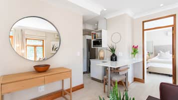 Luxury Apartment, Balcony, Mountain View | Living area | 50-inch Smart TV with cable channels, TV