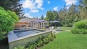 A backyard with a swimming pool, outdoor seating, and a house. - Huge Backyard, Large Living Room with Dining Area, Large Den with Built-In... (Southampton)