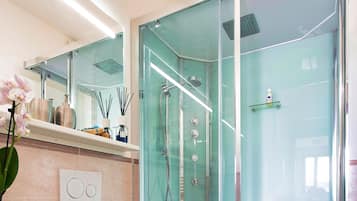 Shower, hair dryer, towels, soap