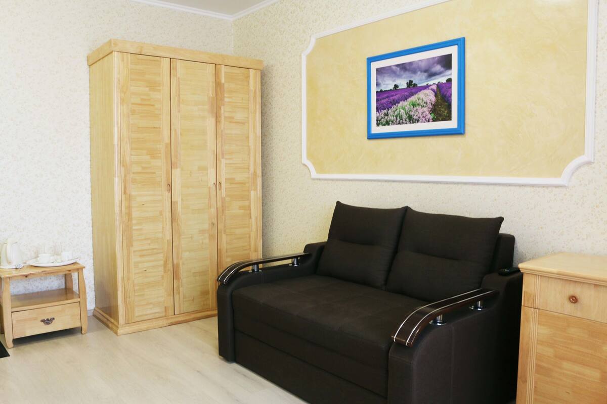 Panoramic Suite | Living room | Flat-screen TV
