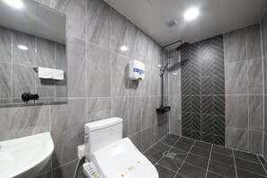 A modern bathroom with a toilet, sink, and shower. - Eco Hotel (Mokpo)