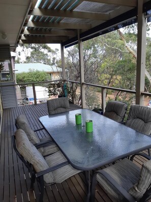 Outdoor dining - Holiday house nestled among native trees overlooking wetlands (Ocean Grove)