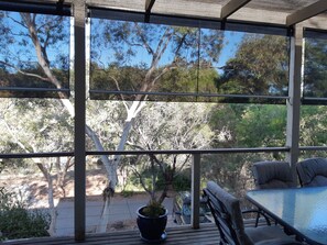 Outdoor dining - Holiday house nestled among native trees overlooking wetlands (Ocean Grove)