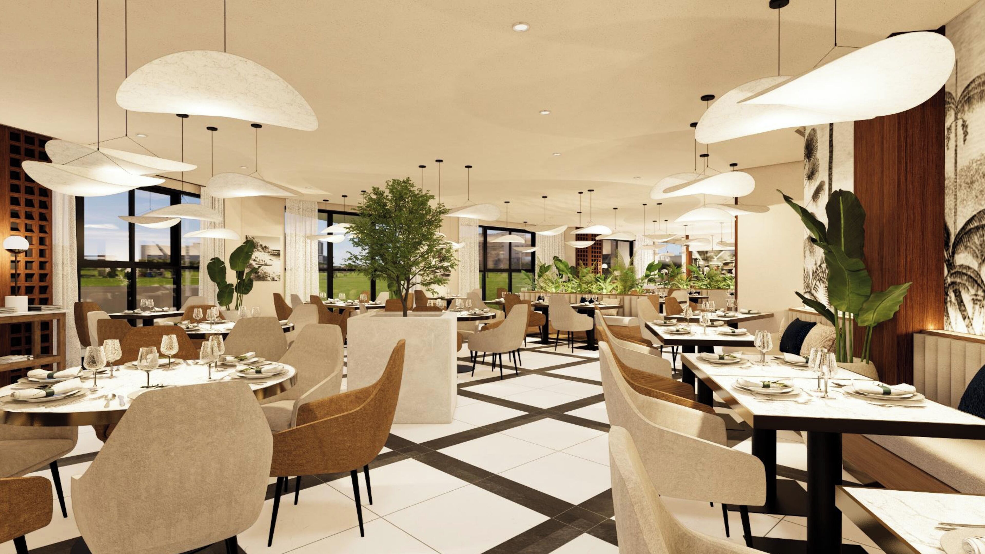 A modern dining area with round tables, beige chairs, and pendant lighting.