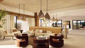 A spacious living area with modern furniture, large windows, and a city view.
