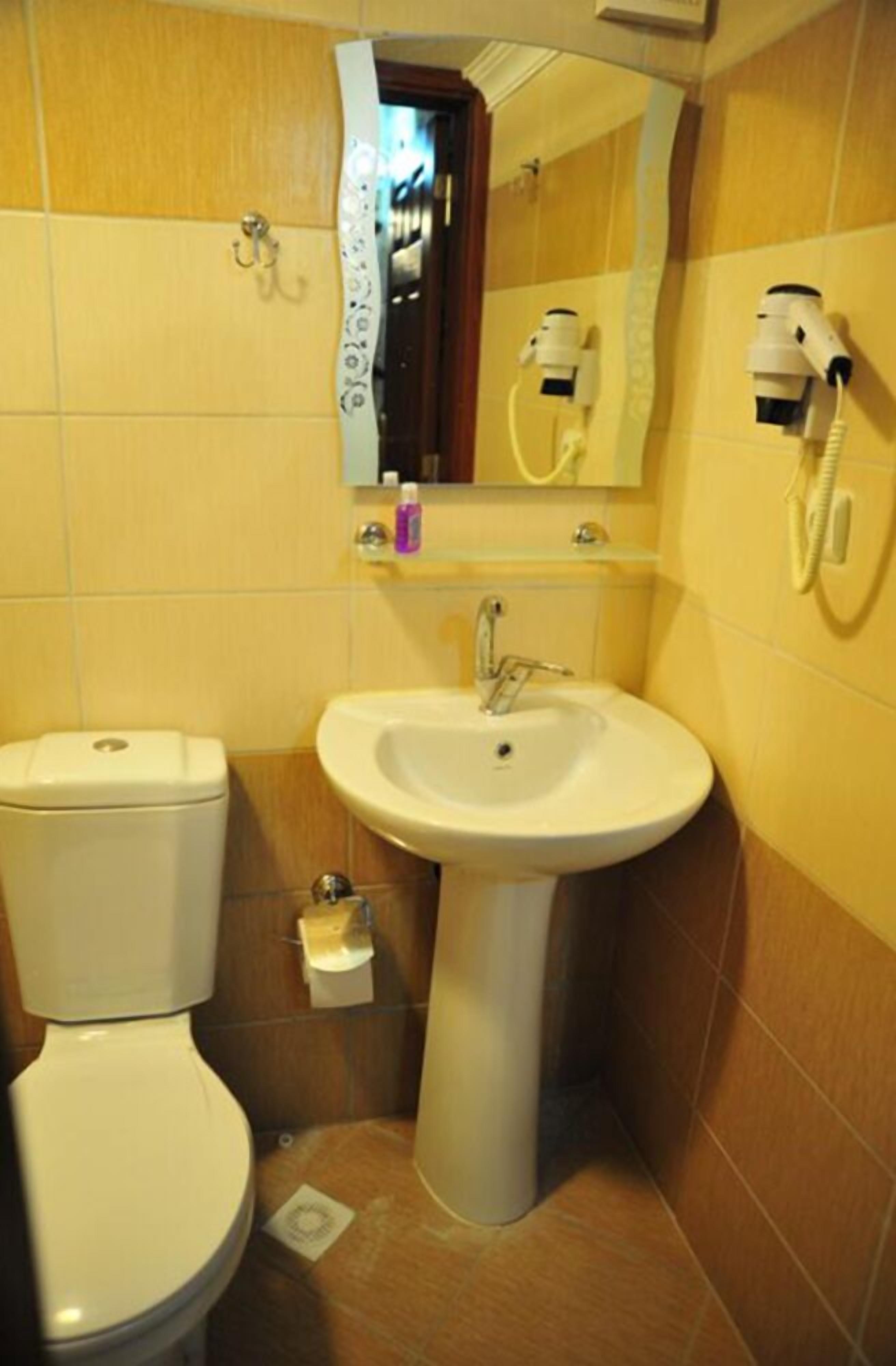 quadruple room | bathroom | shower, rainfall showerhead, hair dryer, slippers