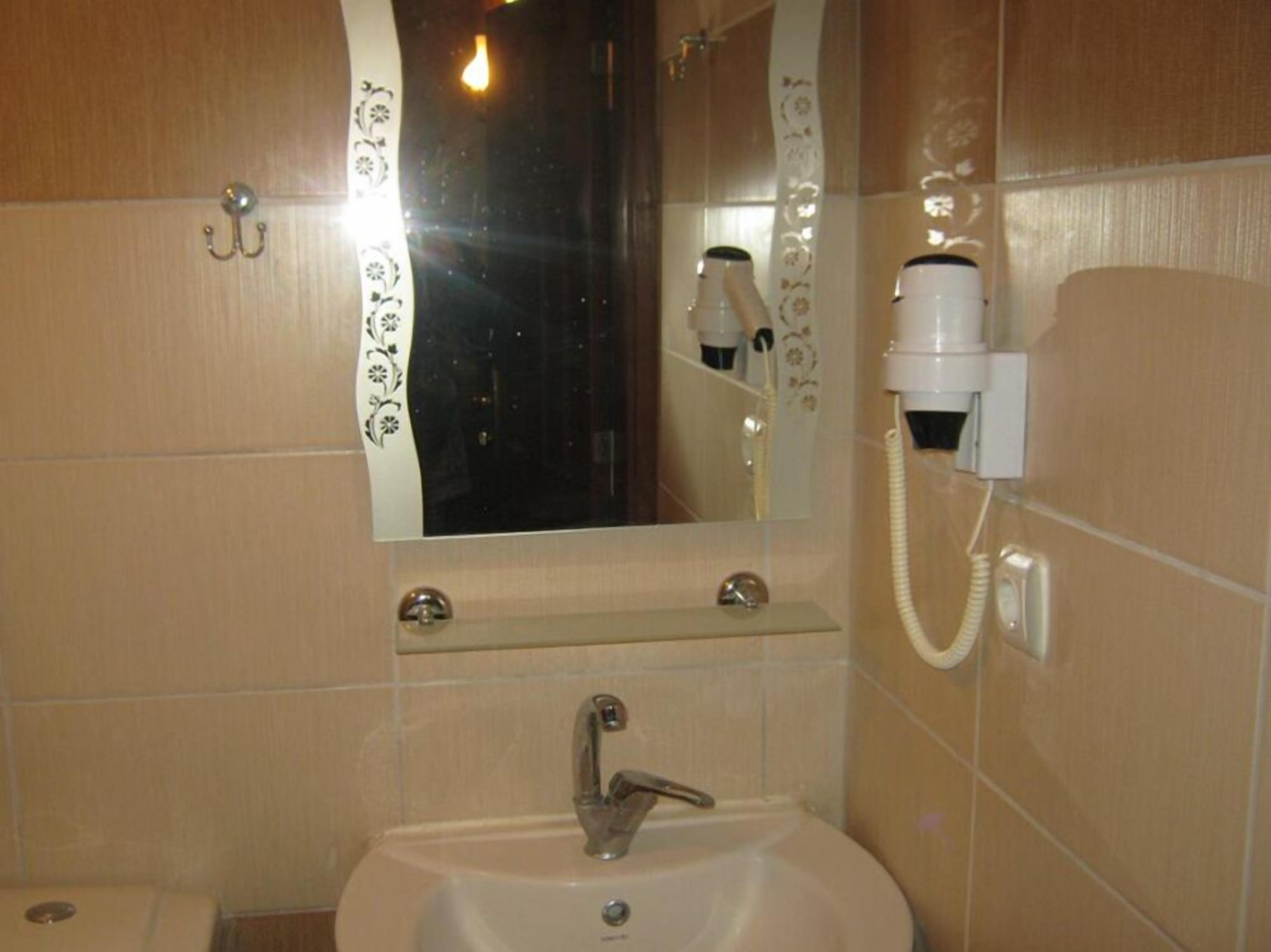 basic triple room | bathroom | shower, rainfall showerhead, hair dryer, slippers