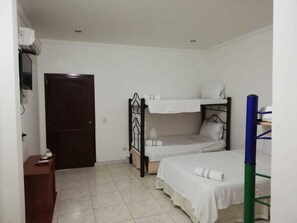 Standard Quadruple Room, Multiple Beds | Premium bedding, blackout drapes, soundproofing, free WiFi - Gran Hotel Valvanera Girardot (Girardot)