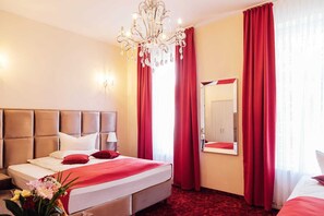 Habitación Deluxe (4 Persons) | Insonorización, wifi gratis y ropa de cama 