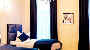 Habitación Deluxe (4 Persons) | Insonorización, wifi gratis y ropa de cama